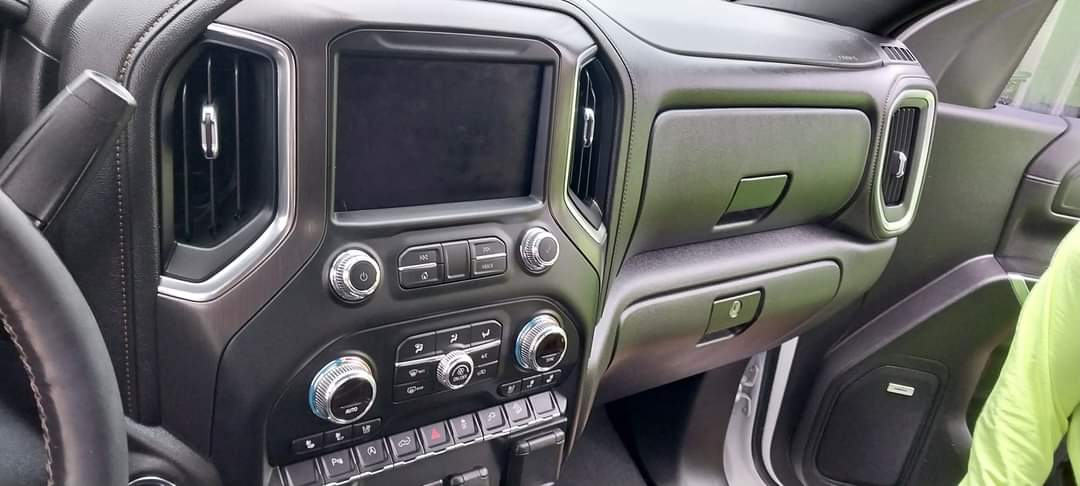 Whie 2019 GMC Sierra -  radio and dashboard view.